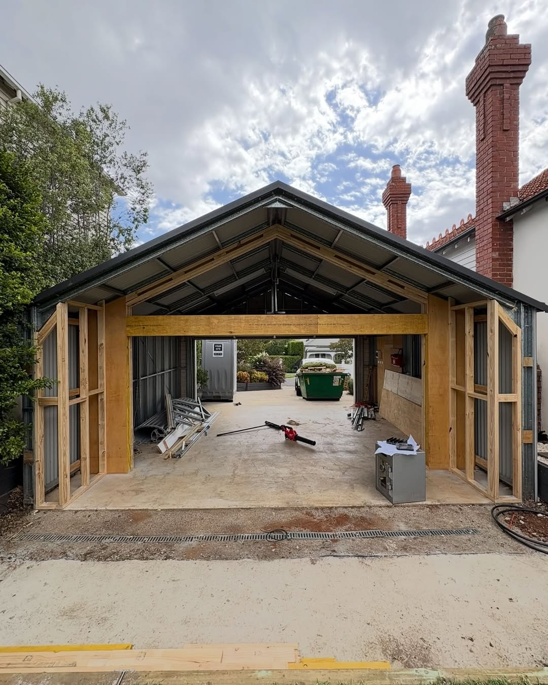 Timber-framed outdoor residential structure under construction